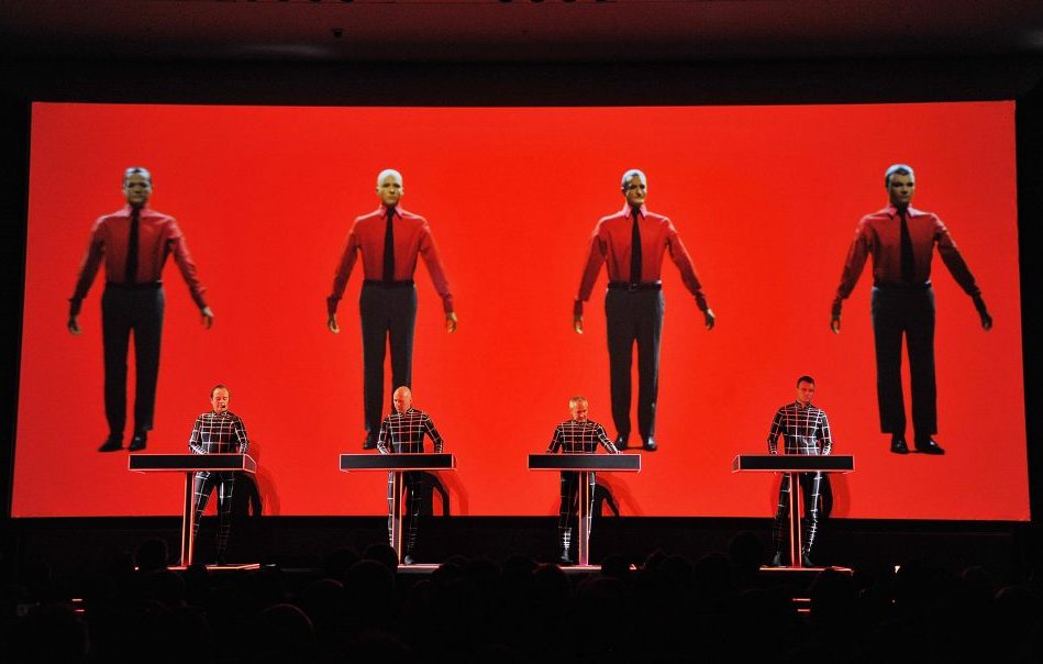 NEW YORK, NY - APRIL 10: (L-R) Ralf H?tter, Henning Schmitz, Fritz Hilpert, and Stefan Pfaffe of the band Kraftwerk perform during the Kraftwerk - Retrospective 1 2 3 4 5 6 7 8, Autobahn (1974) at The Museum of Modern Art on April 10, 2012 in New York City. (Photo by Mike Coppola/Getty Images)